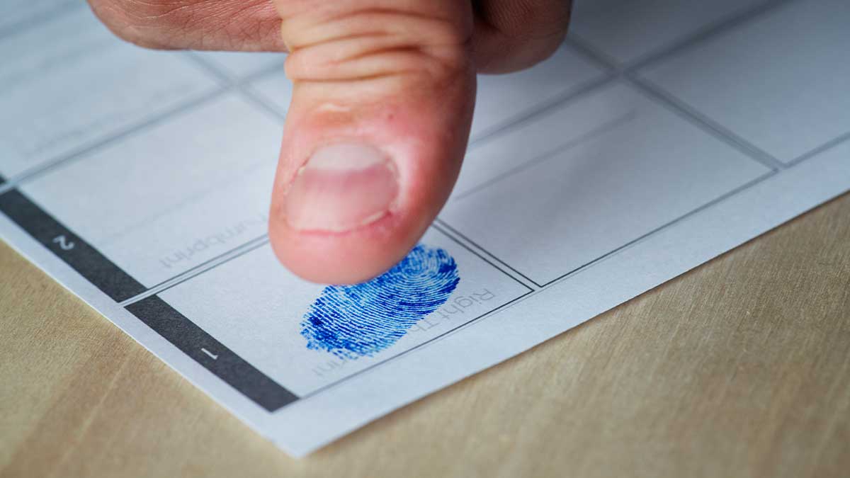 Fingerprints being taken for a South African police clearance certificate application